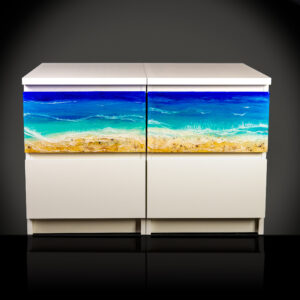 Two resin art pieces mounted to two IKEA nightstands side by side